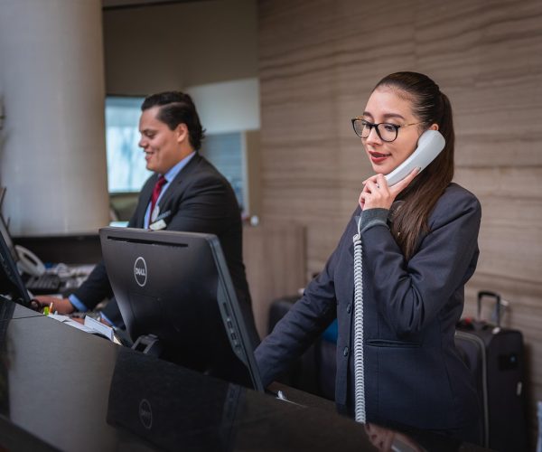 receptionists, phone call, hotel, reception, woman, man, work, attention, lobby, employees, professional, company, assistance, hotel, hotel, hotel, hotel, hotel, reception
